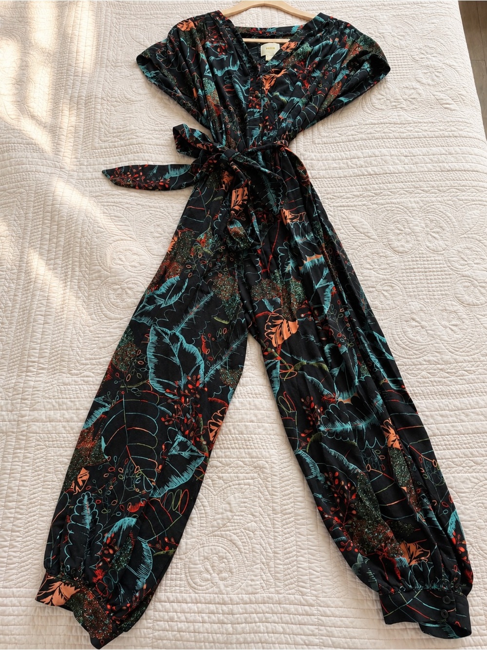 Maeve  from anthropology Black Wrap Jumpsuit with Teal & Coral Floral Print